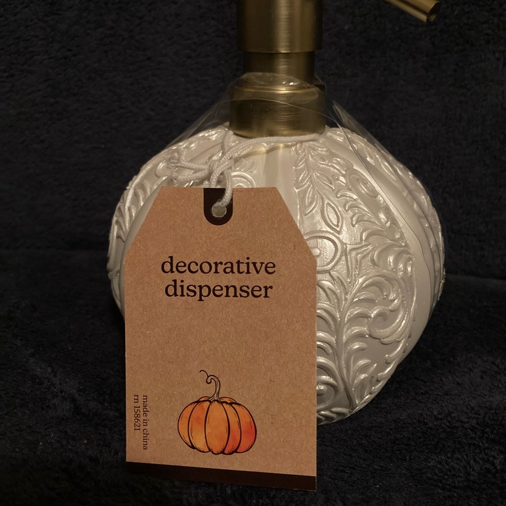 Pearl white pumpkin decorative dispenser with gold pump.